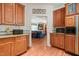 Beautiful kitchen with wooden cabinets, granite countertops, and a view to the living room at 3201 Keighley Forest Dr, Wake Forest, NC 27587