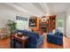 Bright living room with a stone fireplace, custom built-ins, and comfortable seating at 3201 Keighley Forest Dr, Wake Forest, NC 27587