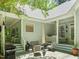 Cozy patio with a comfortable seating arrangement, grill, umbrella and access to covered porches at 3201 Keighley Forest Dr, Wake Forest, NC 27587