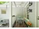 Enclosed porch featuring a ceiling fan, outdoor decor, and seating area with outdoor dining at 3201 Keighley Forest Dr, Wake Forest, NC 27587