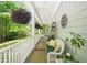 Inviting covered porch featuring comfortable wicker seating, lush foliage, and a relaxing atmosphere at 3201 Keighley Forest Dr, Wake Forest, NC 27587