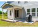 Back porch with a grill, perfect for outdoor entertaining and enjoying the spacious backyard at 325 Porterfield Dr, Youngsville, NC 27596