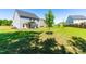 Spacious backyard features a well-manicured lawn and mature tree creating a relaxing outdoor space at 325 Porterfield Dr, Youngsville, NC 27596