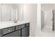 Bathroom with vanity featuring a black cabinet, white countertop, and stylish gold hardware at 325 Porterfield Dr, Youngsville, NC 27596