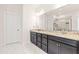 Luxurious bathroom with double vanity, granite countertops, and a glass shower at 325 Porterfield Dr, Youngsville, NC 27596