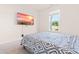 Bright bedroom features a cozy bed and mounted flat-screen television at 325 Porterfield Dr, Youngsville, NC 27596