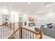 Upstairs living room features a large sectional and media center at 325 Porterfield Dr, Youngsville, NC 27596