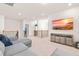 Upstairs living room features a large sectional and media cabinet at 325 Porterfield Dr, Youngsville, NC 27596
