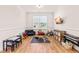 Bright playroom with hardwood floors, toys, and a large window at 325 Porterfield Dr, Youngsville, NC 27596
