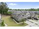 Aerial view of a well-planned neighborhood showcasing homes with manicured lawns and mature trees at 3406 Antler View Dr, Apex, NC 27502