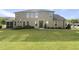 Lush green backyard featuring a well-maintained lawn and a screened-in porch perfect for relaxation at 3406 Antler View Dr, Apex, NC 27502