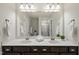 Bathroom featuring a double vanity, large mirror, and a shower at 3406 Antler View Dr, Apex, NC 27502