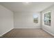 A spacious bedroom with neutral walls, plush carpet, and one window at 3406 Antler View Dr, Apex, NC 27502