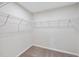 A small closet with wire rack shelving and neutral carpeting at 3406 Antler View Dr, Apex, NC 27502