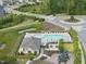 Aerial view of community pool and playground, surrounded by lush greenery and walking trails at 3406 Antler View Dr, Apex, NC 27502