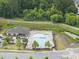 Aerial view of a community pool featuring ample seating and lush landscaping for residents at 3406 Antler View Dr, Apex, NC 27502