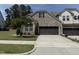 Beautiful brick home with meticulously kept lawn, a tree-lined yard, and convenient attached two-car garage at 3406 Antler View Dr, Apex, NC 27502