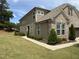 Spacious home featuring a well-maintained lawn, complemented by carefully placed shrubbery and a welcoming walkway at 3406 Antler View Dr, Apex, NC 27502