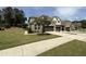 Charming brick home featuring a well-manicured lawn, mature tree, and two-car garage, perfect for suburban living at 3406 Antler View Dr, Apex, NC 27502