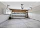 An empty garage with shelving and a ladder in the back at 3406 Antler View Dr, Apex, NC 27502