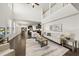 Bright living room with soaring ceilings and hardwood floors flowing into the adjacent kitchen at 3406 Antler View Dr, Apex, NC 27502