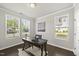 Home office with a rustic wood desk, natural light and neutral walls at 3406 Antler View Dr, Apex, NC 27502