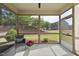 Relaxing screened porch with a view of the backyard, perfect for enjoying the outdoors in comfort at 3406 Antler View Dr, Apex, NC 27502