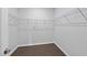 Walk-in closet with dark wood floor and wire shelving for optimal storage and organization at 3406 Antler View Dr, Apex, NC 27502