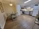 Updated kitchen with stainless steel appliances and light gray cabinets and a dining area with seating at 3523 Ivy Commons Dr # 102, Raleigh, NC 27606