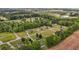 Aerial view of a residential neighborhood surrounded by lush trees and greenery at 3603 Westmeadow Ln, Elon, NC 27244
