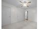 Neutral bedroom with two closets, ceiling fan and access to the rest of the house at 3603 Westmeadow Ln, Elon, NC 27244