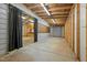 View of unfinished space adjacent to a kitchenette and featuring metal and wood framing at 3603 Westmeadow Ln, Elon, NC 27244