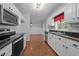 Charming kitchen with stainless steel appliances, hardwood floors, and eat-in dining space at 3603 Westmeadow Ln, Elon, NC 27244