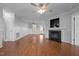 Expansive living room features a fireplace, hardwood flooring, and ample space for comfortable living at 3603 Westmeadow Ln, Elon, NC 27244
