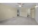 Large main bedroom offers a ceiling fan, neutral carpet and access to two bathrooms at 3603 Westmeadow Ln, Elon, NC 27244