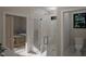 Modern bathroom with a glass shower stall and view into the bedroom, along with a toilet at 389 Deer Tail Ln # 39, Fuquay Varina, NC 27526