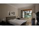 Inviting bedroom with neutral tones, a plush bed, and a large window offering natural light at 389 Deer Tail Ln # 39, Fuquay Varina, NC 27526