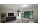 Beautiful bedroom with black dresser, modern light fixture, large windows and a view to the outdoors at 389 Deer Tail Ln # 39, Fuquay Varina, NC 27526