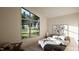 Bright bedroom with large window overlooking green landscape, modern decor, and a comfortable bed at 389 Deer Tail Ln # 39, Fuquay Varina, NC 27526