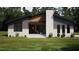 Charming single-story home with covered porch, stone accents, and professionally landscaped front yard at 389 Deer Tail Ln # 39, Fuquay Varina, NC 27526