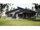 Charming single story home boasts modern architectural design and a covered patio on a lush lot at 389 Deer Tail Ln # 39, Fuquay Varina, NC 27526