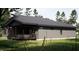 Single story home with covered porch; a perfect spot to relax outdoors and enjoy the beautiful surroundings at 389 Deer Tail Ln # 39, Fuquay Varina, NC 27526