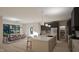 Bright kitchen with stainless steel appliances, a central island with seating, and an adjacent dining area at 389 Deer Tail Ln # 39, Fuquay Varina, NC 27526