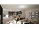 Open-concept living space with a view of the kitchen island with pendant lighting and gray cabinetry at 389 Deer Tail Ln # 39, Fuquay Varina, NC 27526
