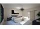 Serene main bedroom with a modern chandelier, minimalist decor, and a luxurious en-suite bathroom at 389 Deer Tail Ln # 39, Fuquay Varina, NC 27526
