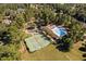 Aerial view highlighting community amenities including a tennis court and pool at 39 Forked Pine Ct, Chapel Hill, NC 27517