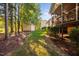 Backyard with an exterior shed and a view of the screened-in porch in the background at 39 Forked Pine Ct, Chapel Hill, NC 27517