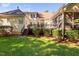 Spacious backyard featuring a wooden deck with stairs and lush landscaping around the house at 39 Forked Pine Ct, Chapel Hill, NC 27517