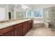 The bathroom showcases a double sink vanity, garden tub, and tiled shower at 39 Forked Pine Ct, Chapel Hill, NC 27517