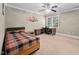 Comfortable bedroom features a ceiling fan, desk and study area, and a cozy bed, perfect for relaxing at 39 Forked Pine Ct, Chapel Hill, NC 27517
